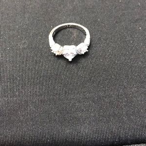 3 Stones 1 in center ❤️ shaped round on each side.